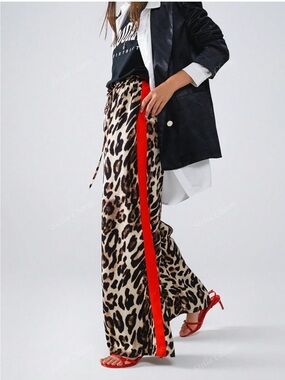 Leopard print wide leg pants with red stripe. NWOT